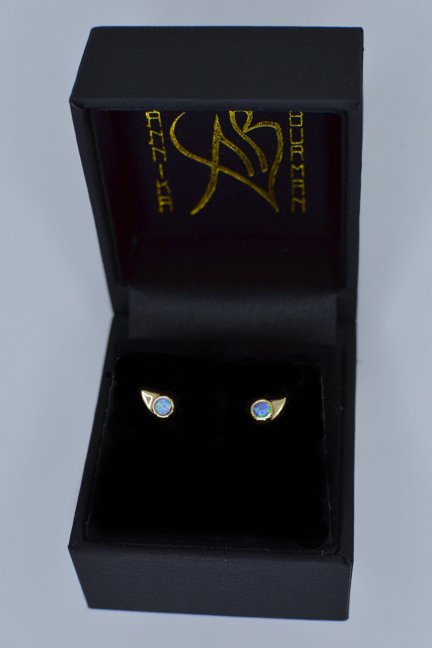 lynx gold and opal stud earrings by Annika Burman