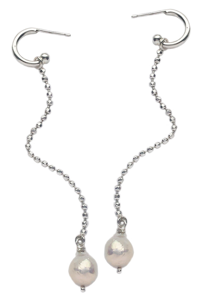 Long silver earrings with baroque pearls by Annika Burman