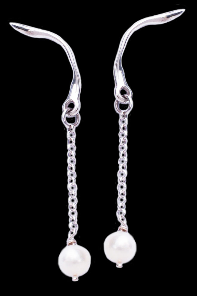 Winged Earrings in silver with white pearls by Annika Burman