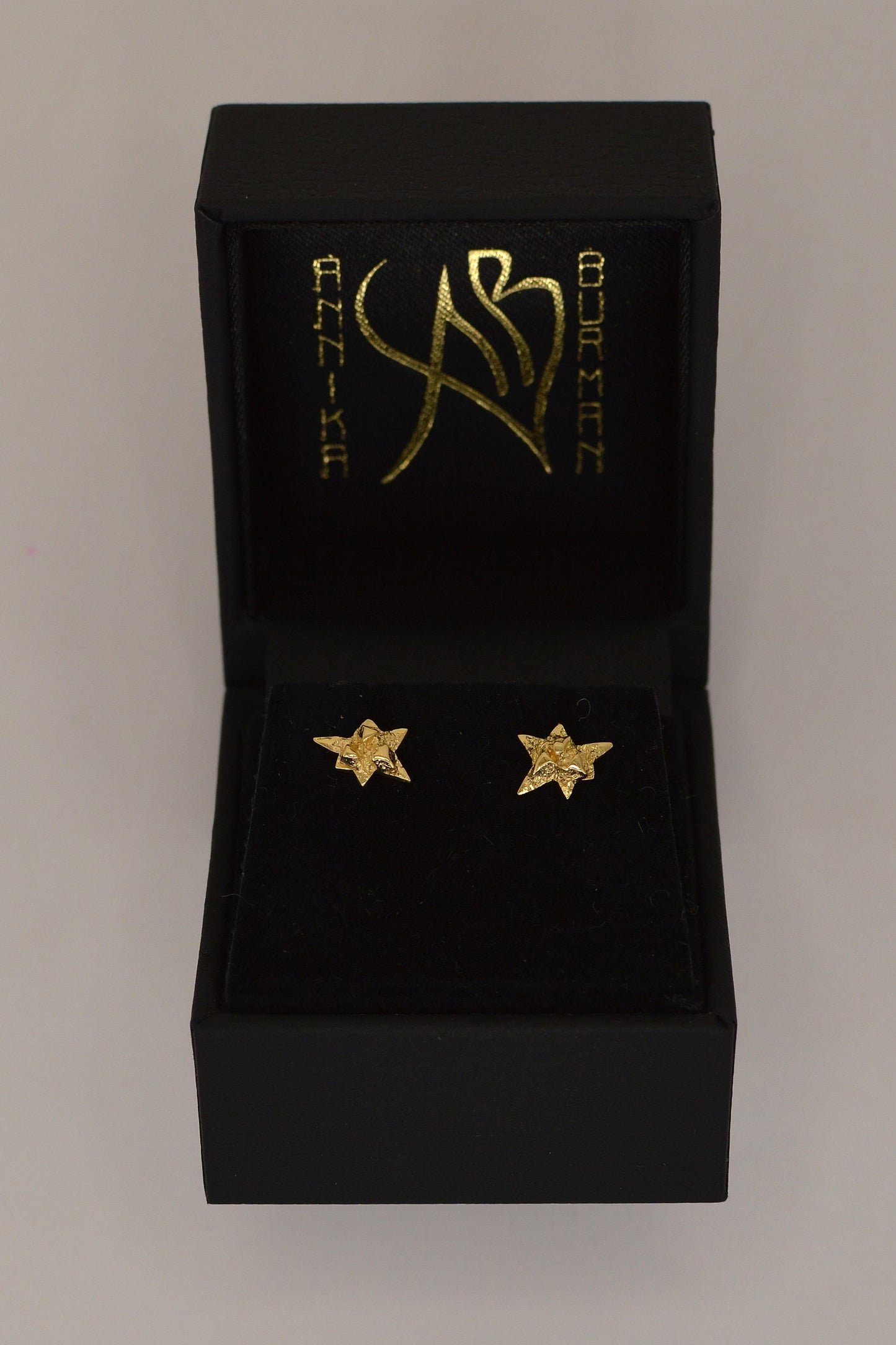 Nova gold earrings by Annika Burman in branded packaging