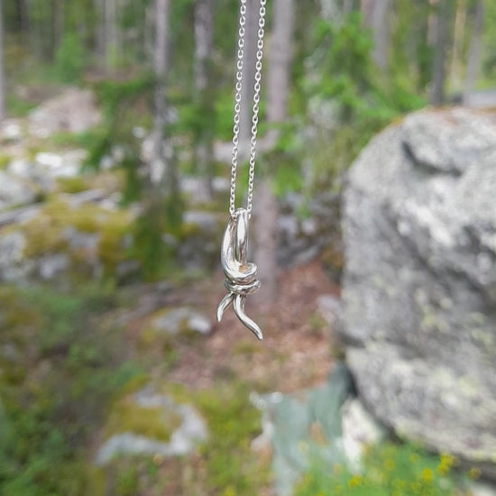 Knot pendant necklace in silver from the Trix collection. video view of necklace, handmade designer jewellery  by Annika Burman