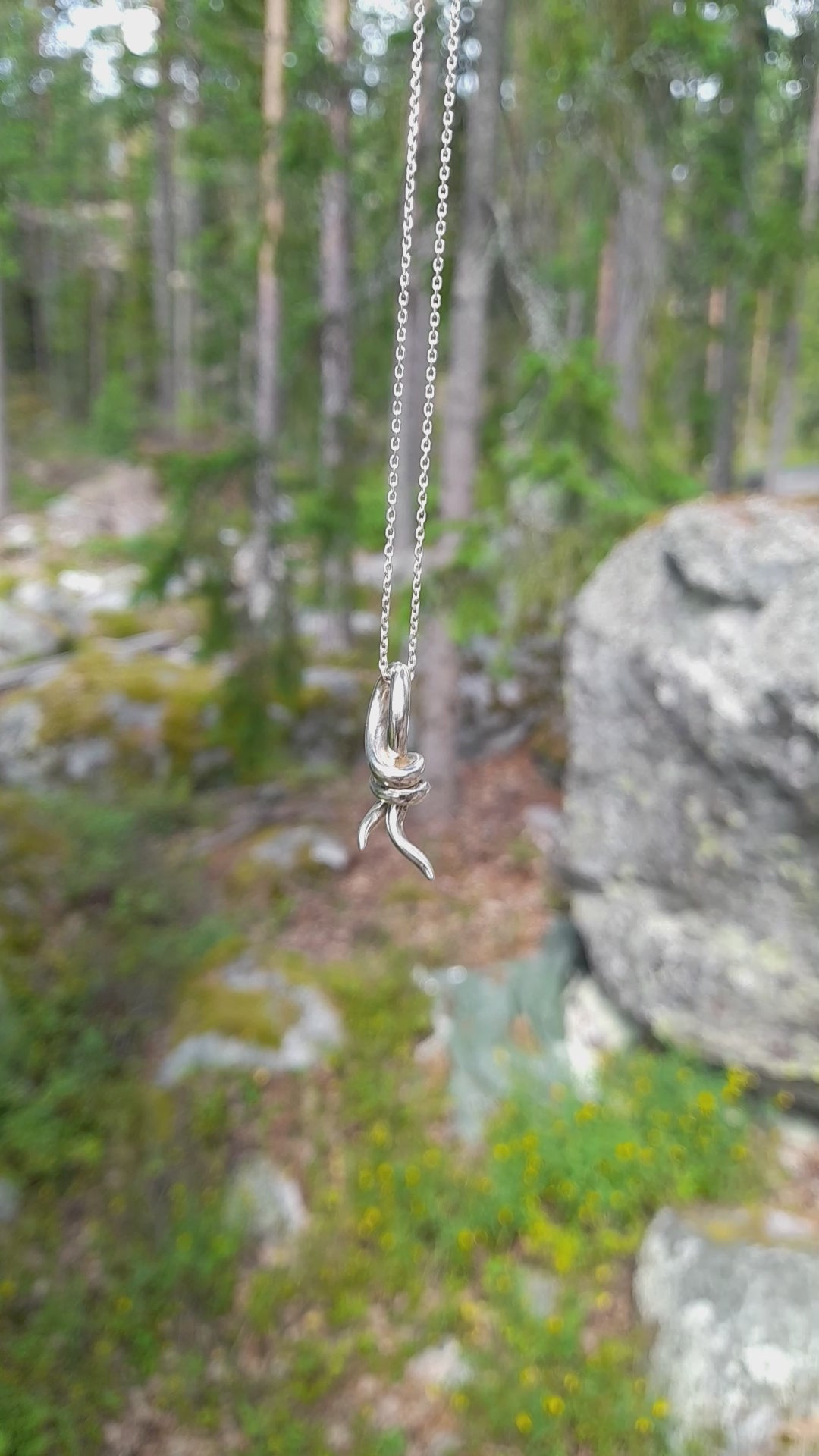 Knot pendant necklace in silver from the Trix collection. video view of necklace, handmade designer jewellery  by Annika Burman