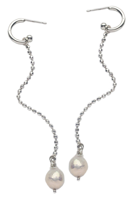 Long silver earrings with baroque pearls by Annika Burman