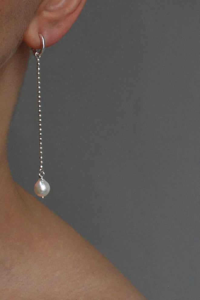 Long silver earrings with baroque pearls by Annika Burman