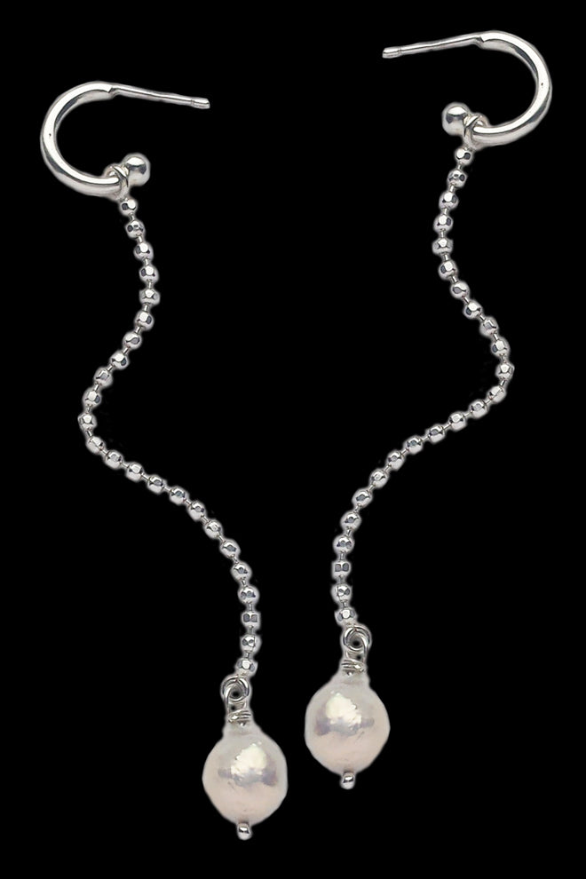 Long silver earrings with baroque pearls by Annika Burman